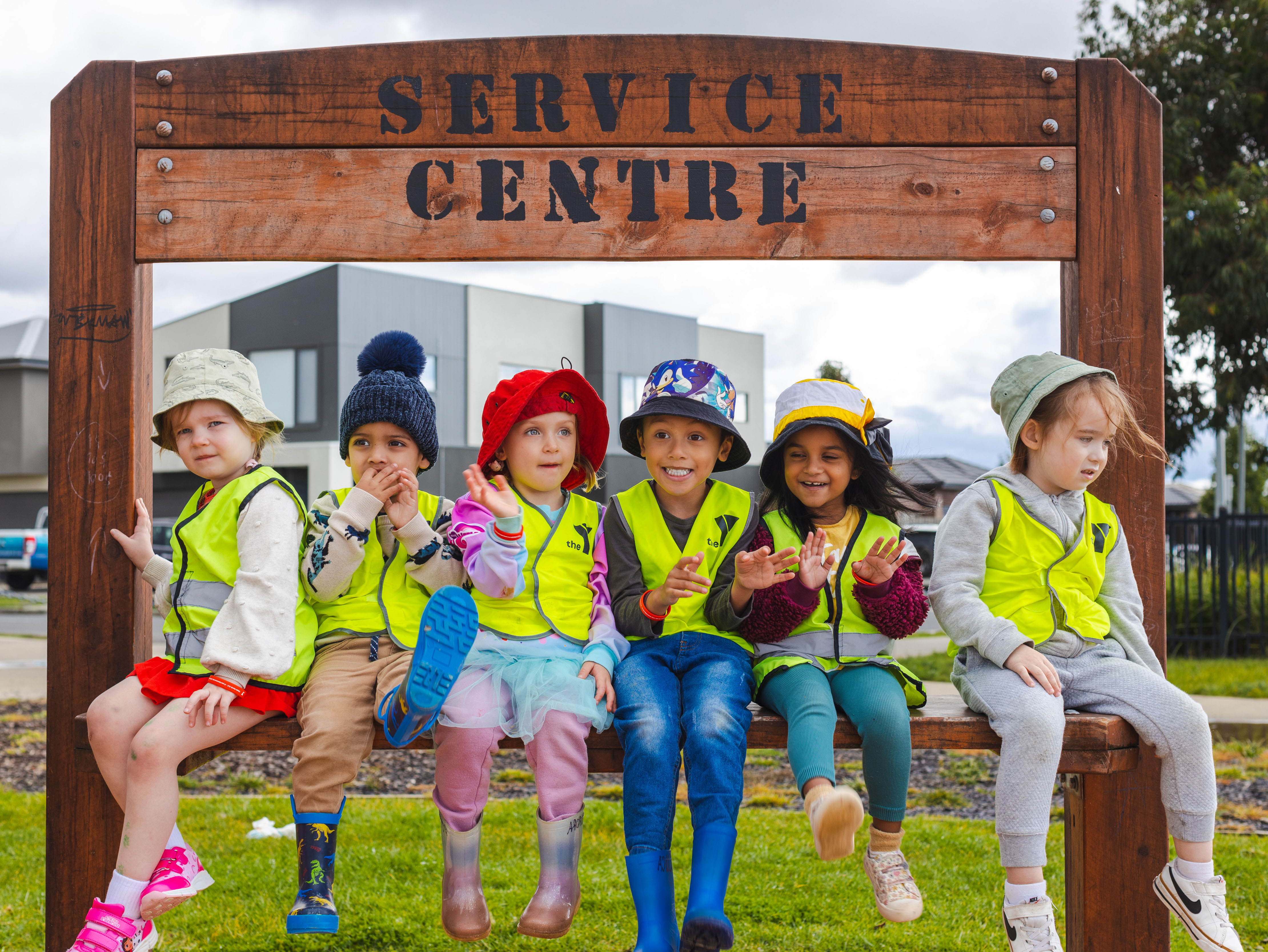 Group of children going on an excursion wearing Y branded hi-vis vests
