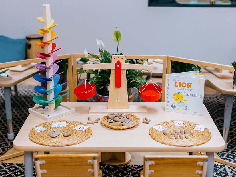 Room with table filled with toys