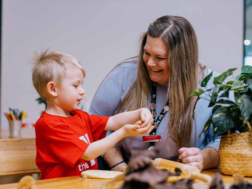 Staff and child playing