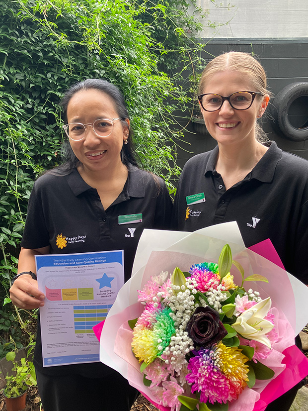 Two Y Early Learning Centre Managers holding a bouquet of flowers and their VECRA NQS certificate