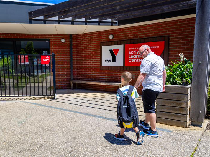 Dad walking with his child to a Y Early Learning Centre
